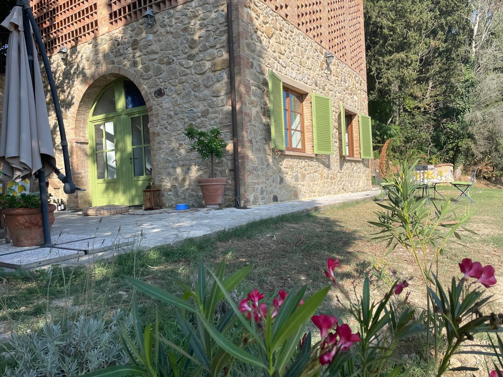 Stone villa garden front with flowering oleander