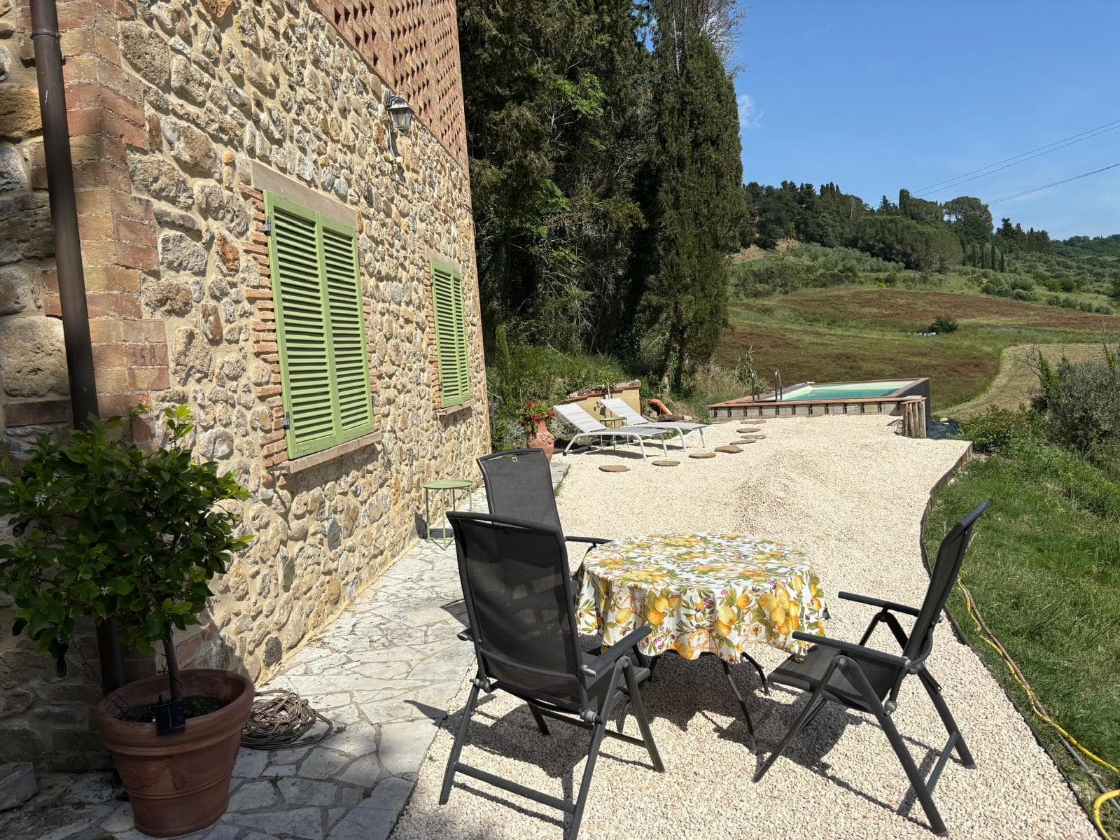 Outdoor dining on the Casa Brunelli terrace at golden hour